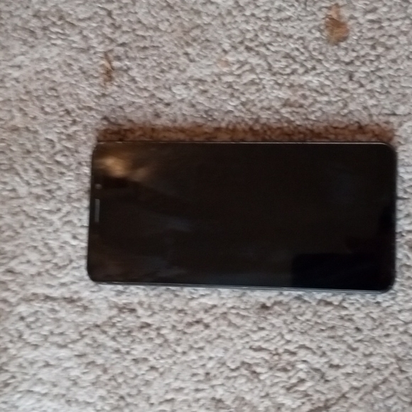 TCL phone and Skullcandy headphones